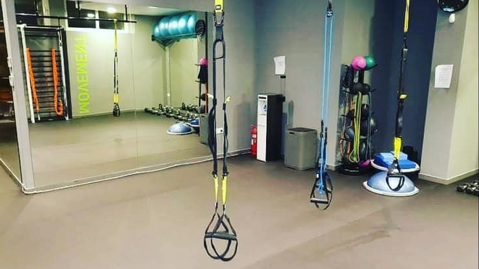 The Hack Fit functional training studio with TRX and the lime MOVEMENT wall