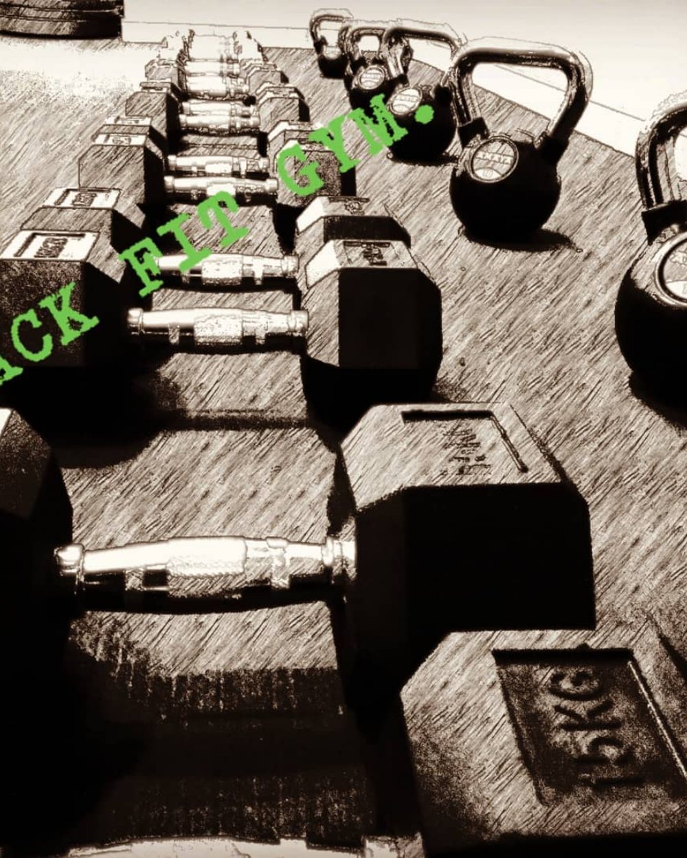 Dumbbells and kettlebells lined up on the floor at Hack Fit