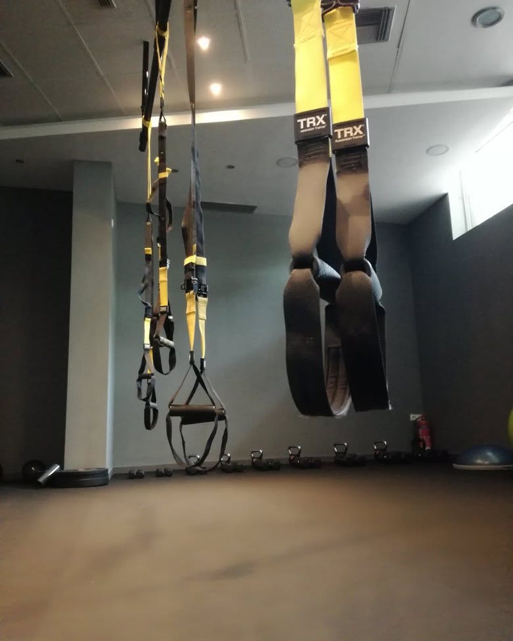 TRX suspension trainers on the wall at Hack Fit